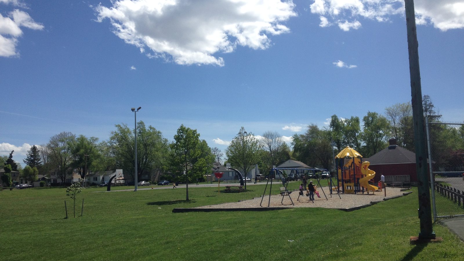 Open lawn and playground area at Crestmont Park in Abington, Pennsylvania
