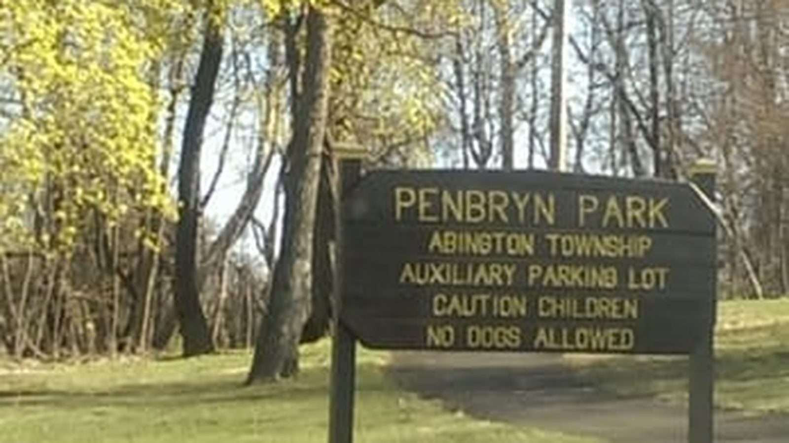 Wooden Penbryn Park sign among trees in Abington Township, Pennsylvania