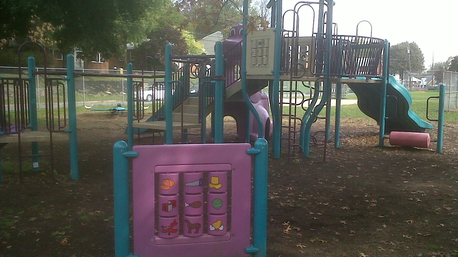 A colorful small scale play structure suited to toddlers in a township park, similar to the tot lot at Ralph Morgan Park near Jenkintown, Pennsylvania